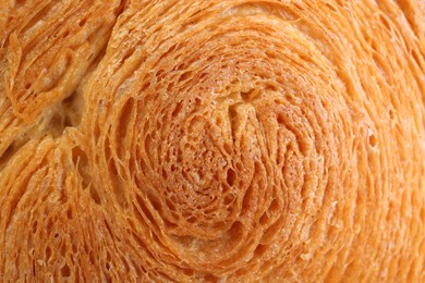 Photo of Tasty puff pastry. Supreme croissant as background, closeup