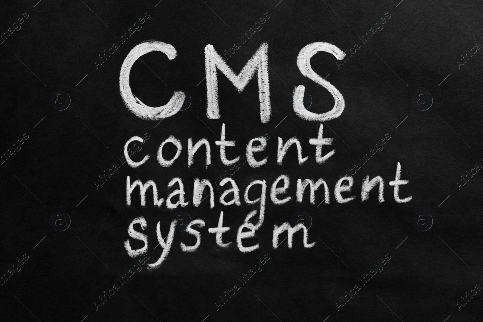 Photo of Abbreviation CMS (Content Management System) on black background