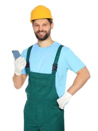 Photo of Professional repairman in uniform with smartphone on white background