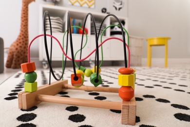 Toy bead maze on floor in child's room