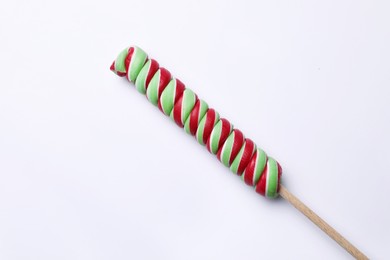 Sweet colorful lollipop on light background, top view