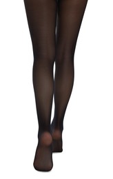 Woman with beautiful long legs wearing black tights on white background, closeup