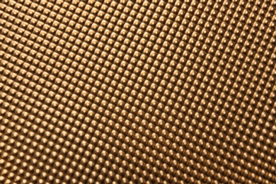 Photo of Blurred view of golden surface as background