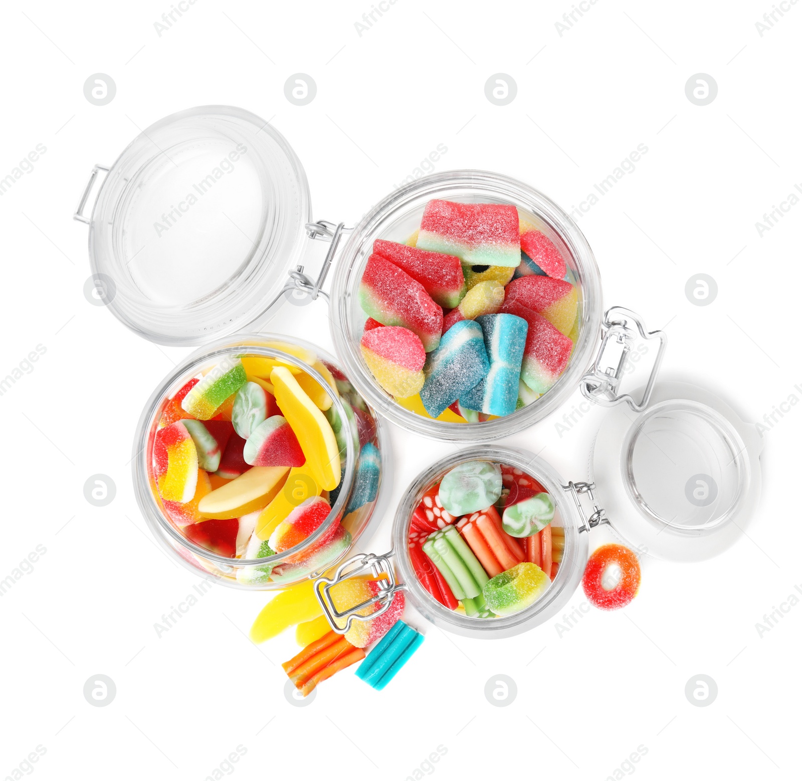 Photo of Tasty jelly candies in jars on white background, top view