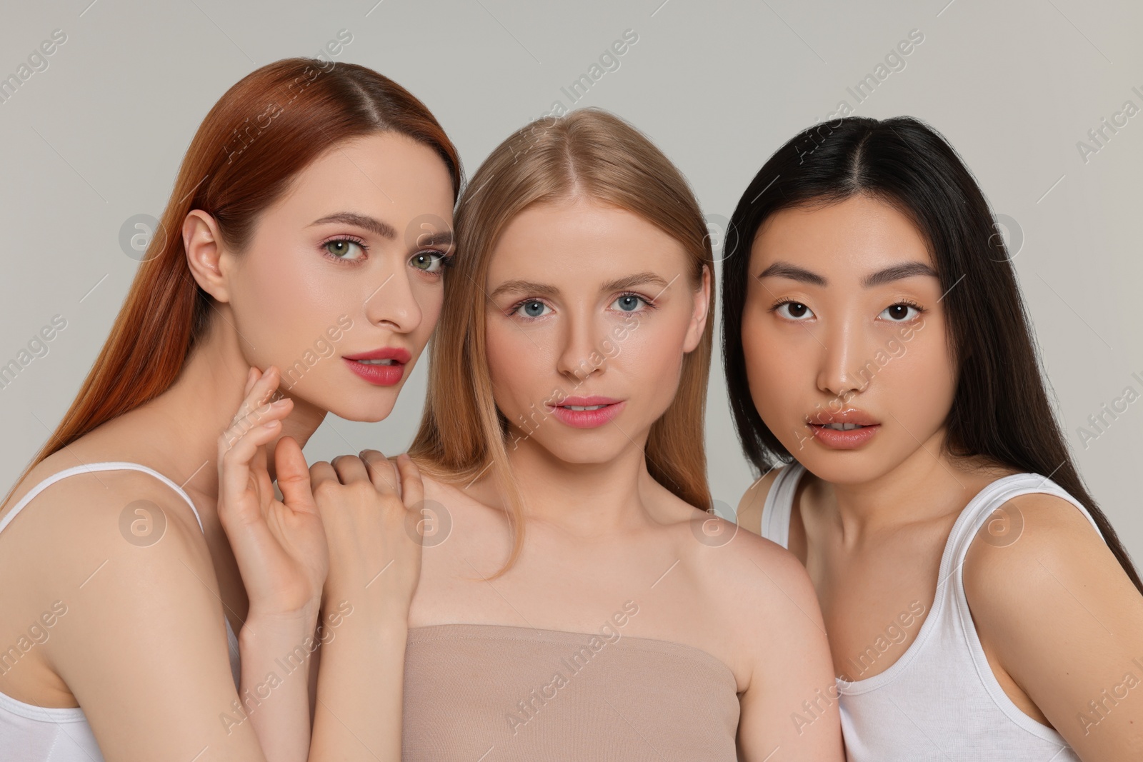 Photo of Portrait of beautiful young women on light grey background