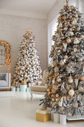 Beautiful interior of living room with decorated Christmas trees