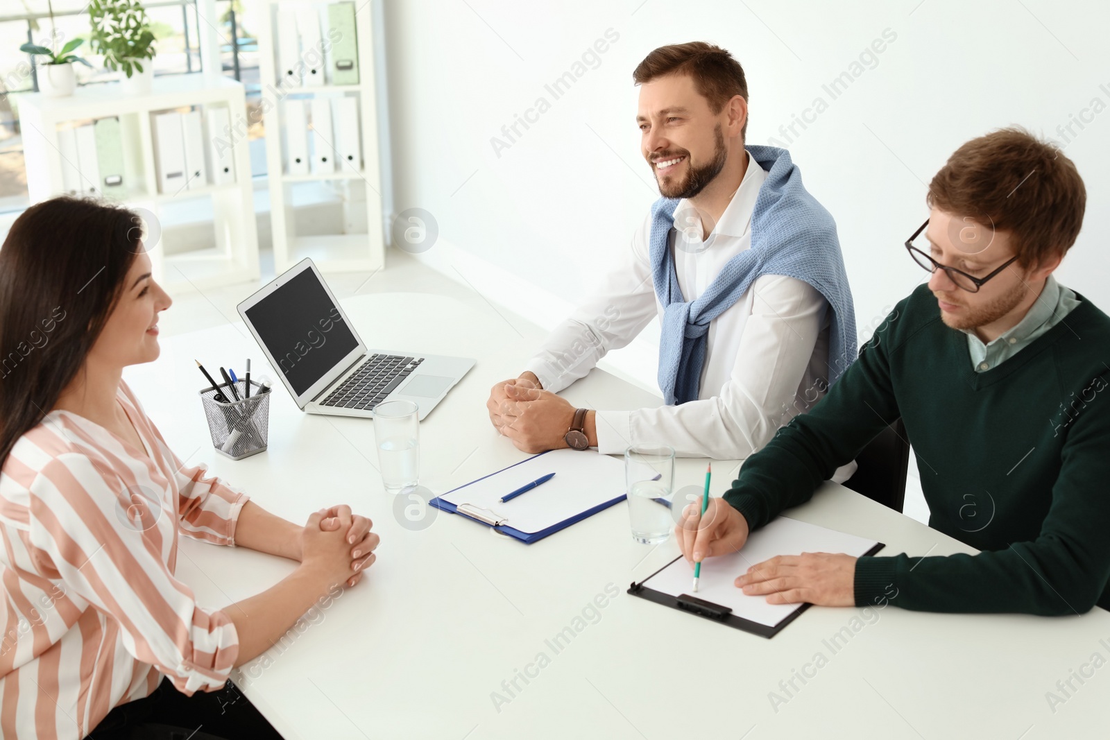 Photo of Human resources commission conducting job interview with applicant in office