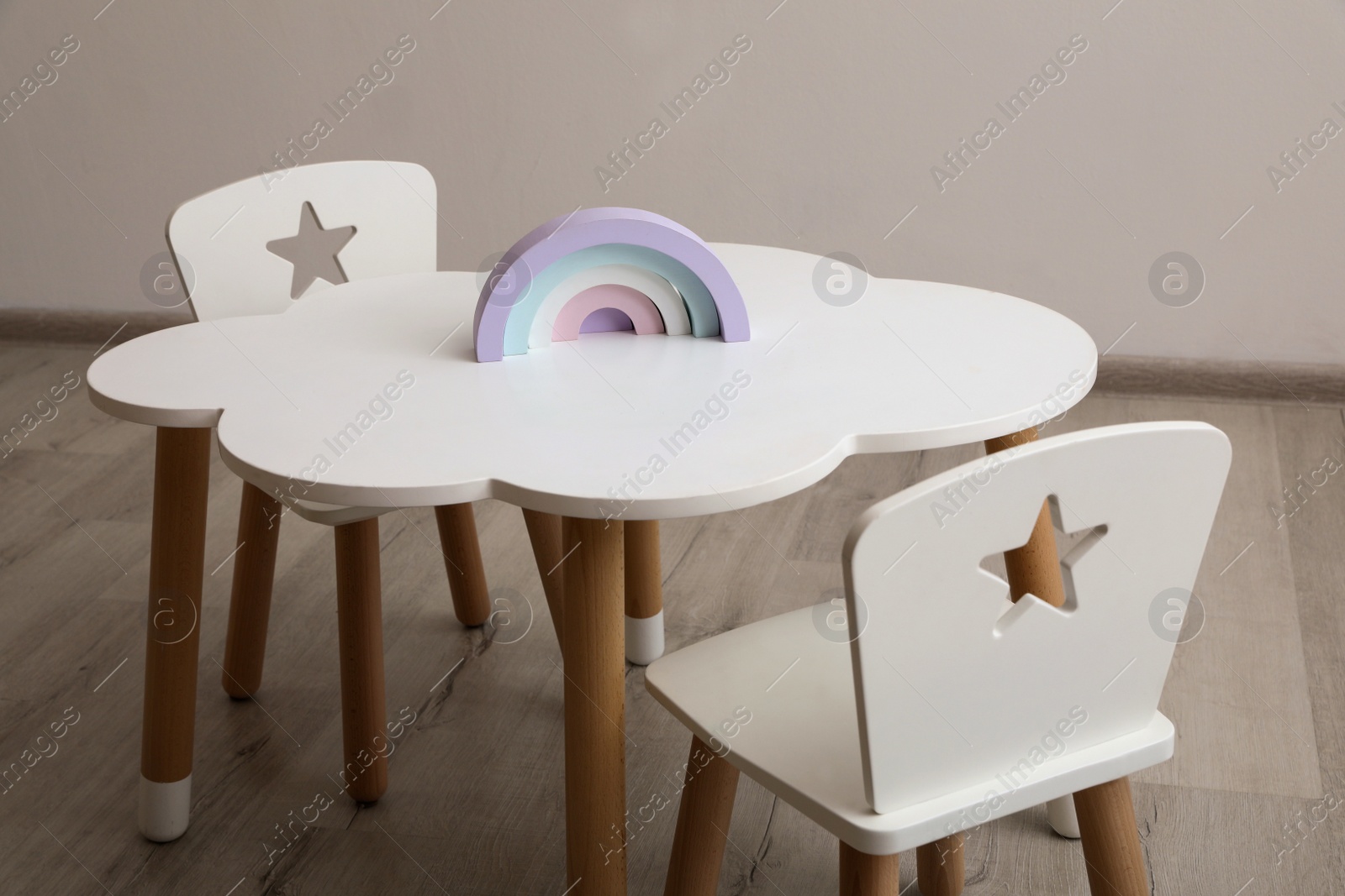 Photo of Small table and chairs in baby room