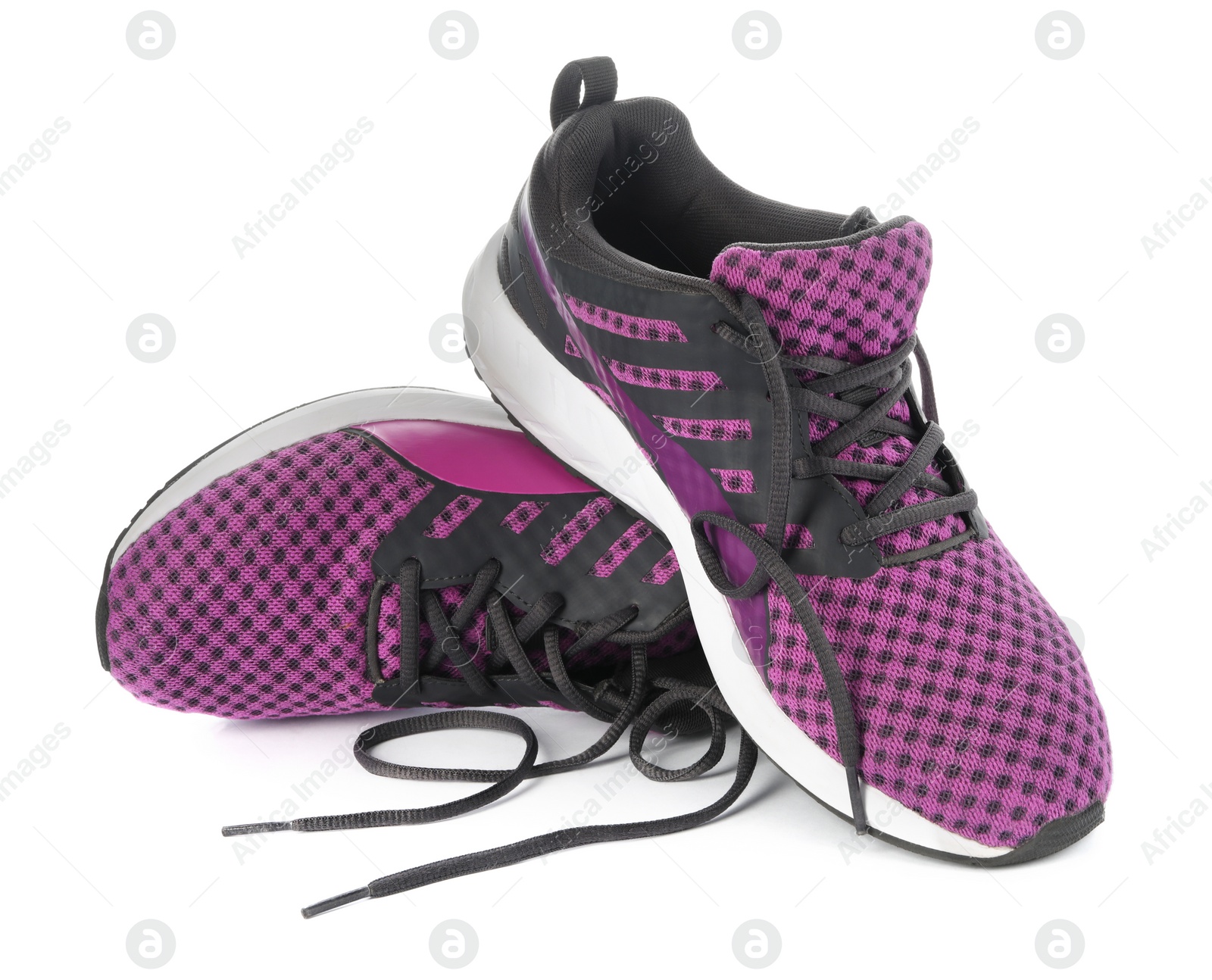 Photo of Stylish purple sneakers with black shoelaces on white background
