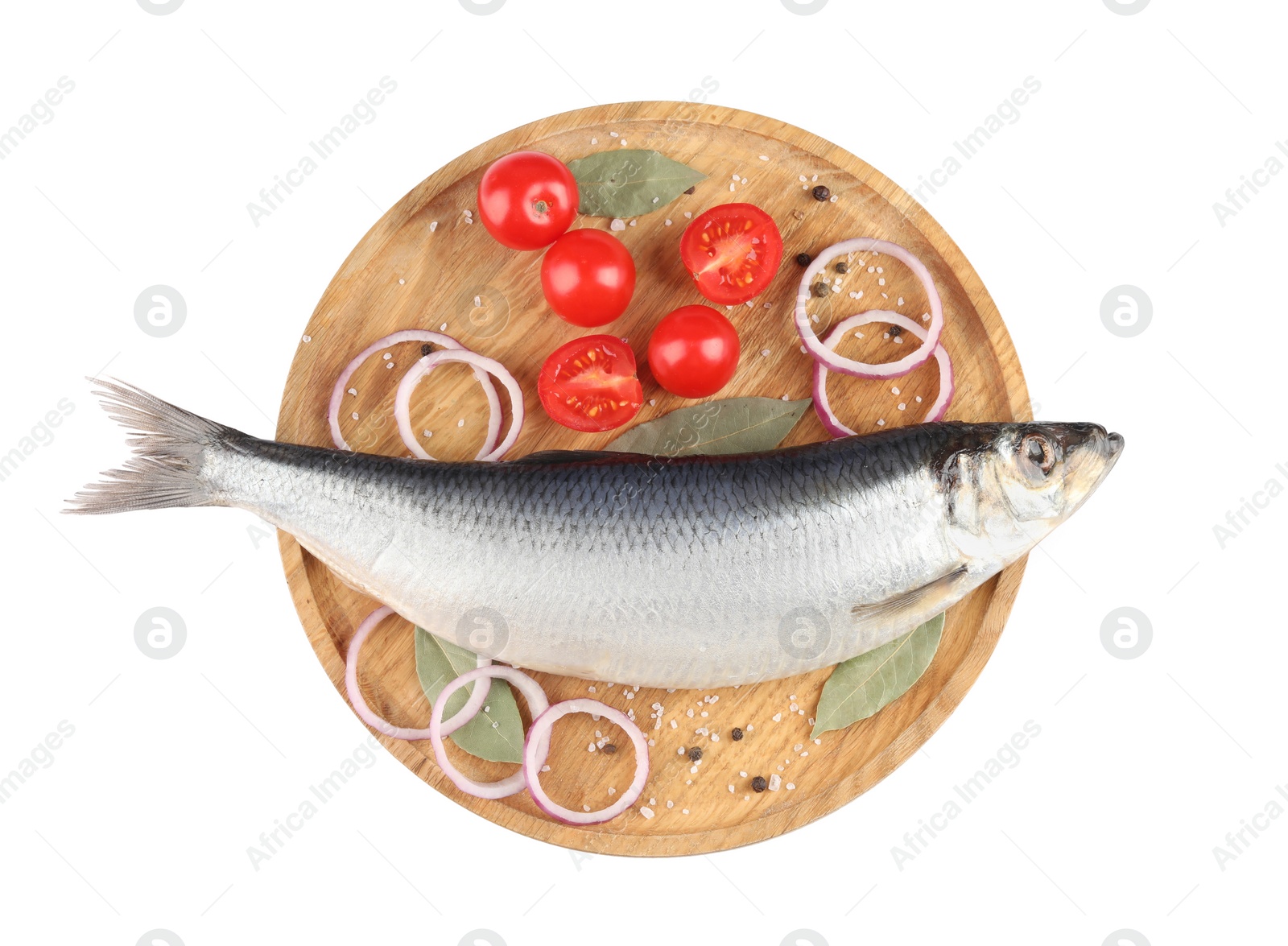 Photo of Wooden tray with salted herring, cherry tomatoes, bay leaves, onion rings and peppercorns isolated on white, top view