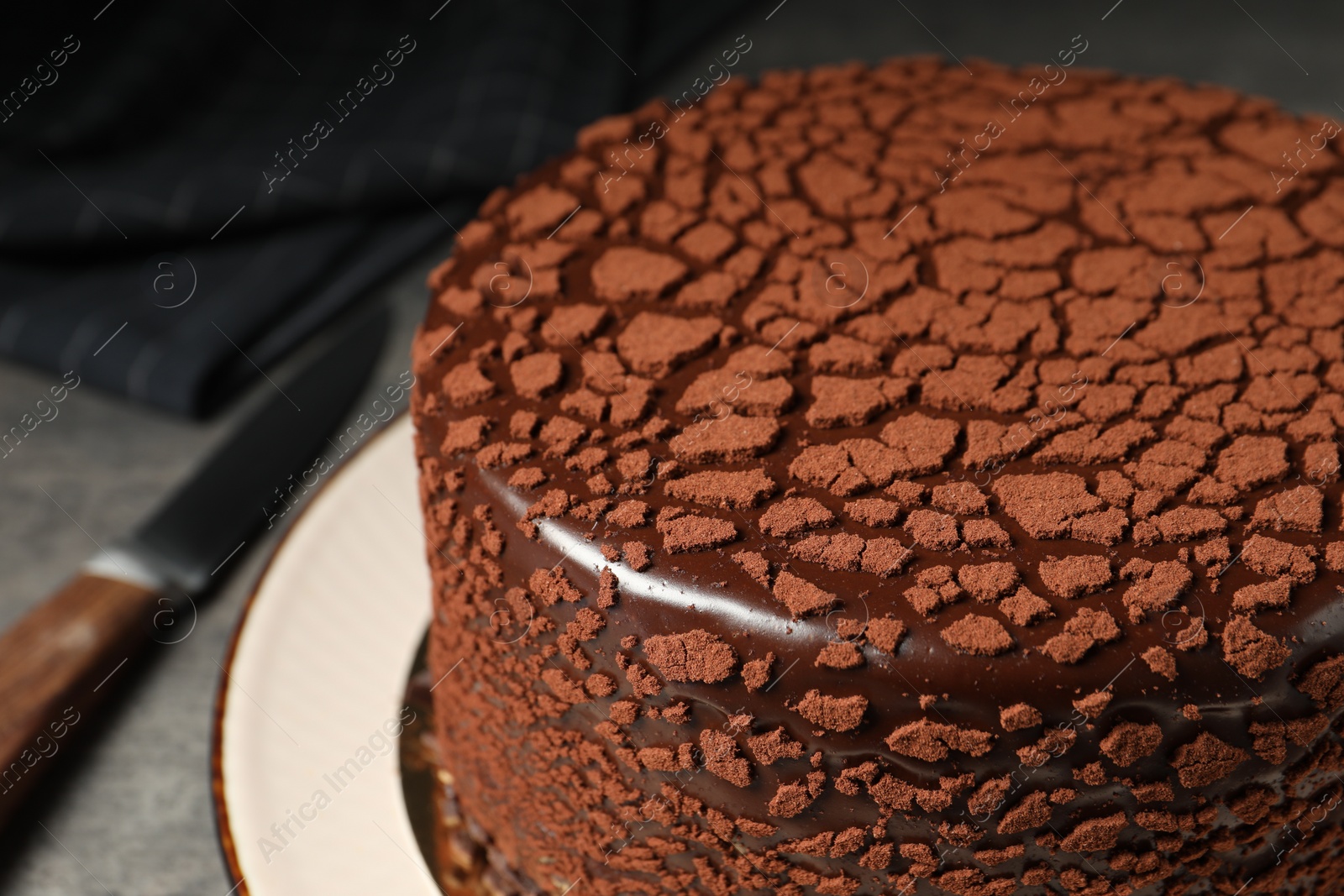 Photo of Delicious chocolate truffle cake on table, closeup