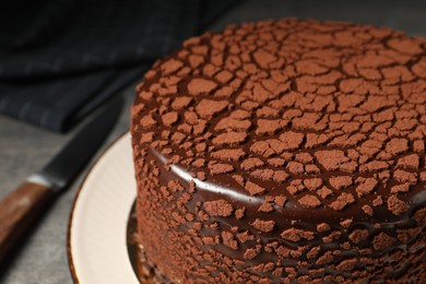 Delicious chocolate truffle cake on table, closeup