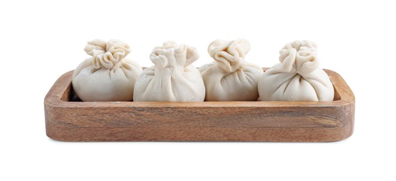 Photo of Wooden tray with uncooked khinkali (dumplings) isolated on white. Georgian cuisine