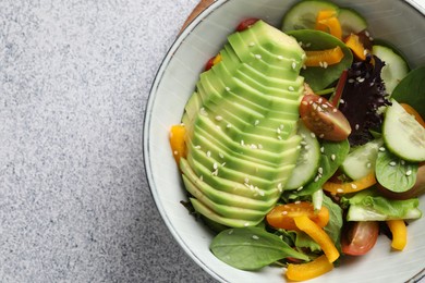 Photo of Healthy dish high in vegetable fats on light textured table, top view. Space for text