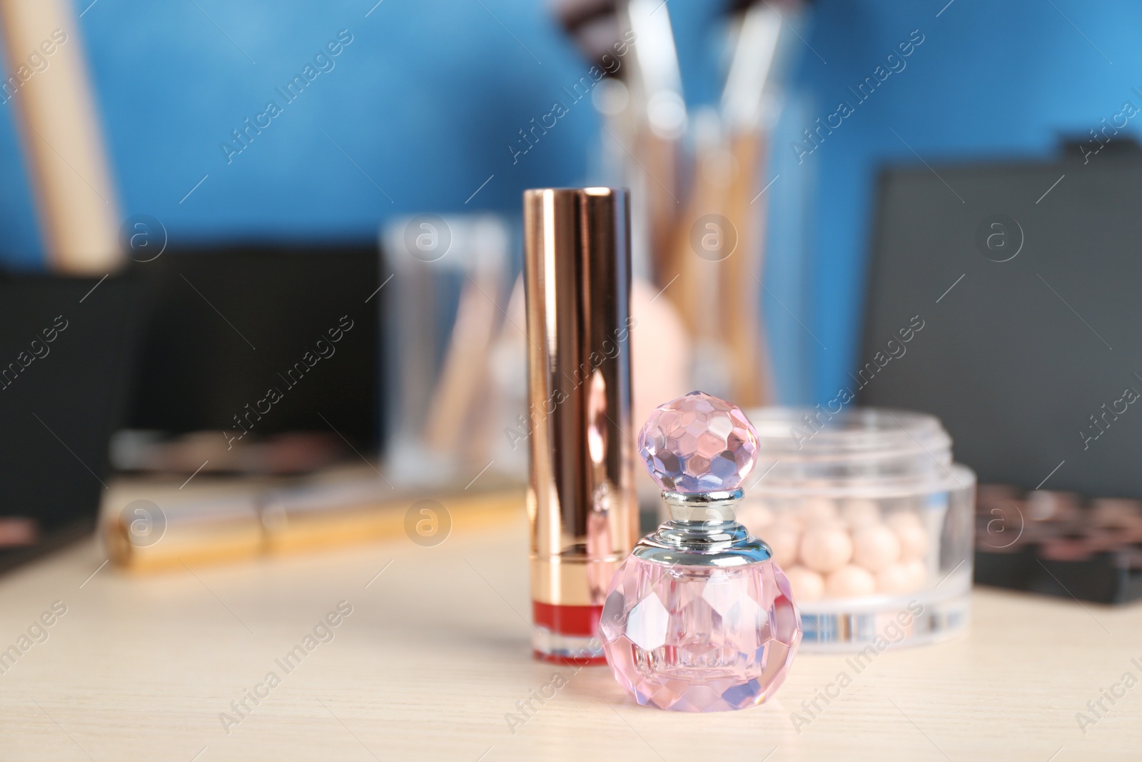 Photo of Set of luxury cosmetics on dressing table. Space for text