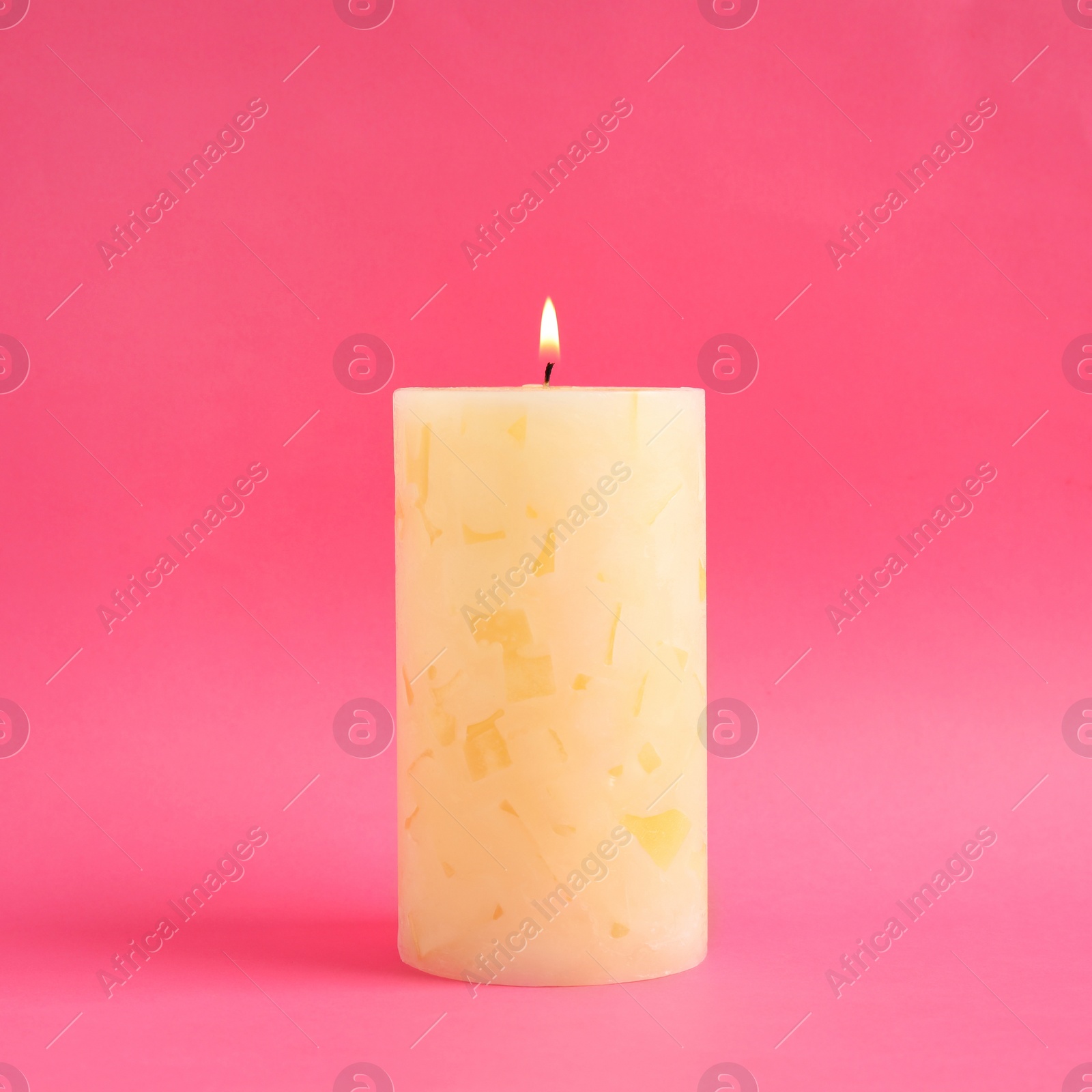 Photo of Alight scented wax candle on color background