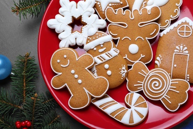 Photo of Tasty Christmas cookies on grey table, flat lay