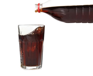 Photo of Pouring refreshing cola into glass on white background