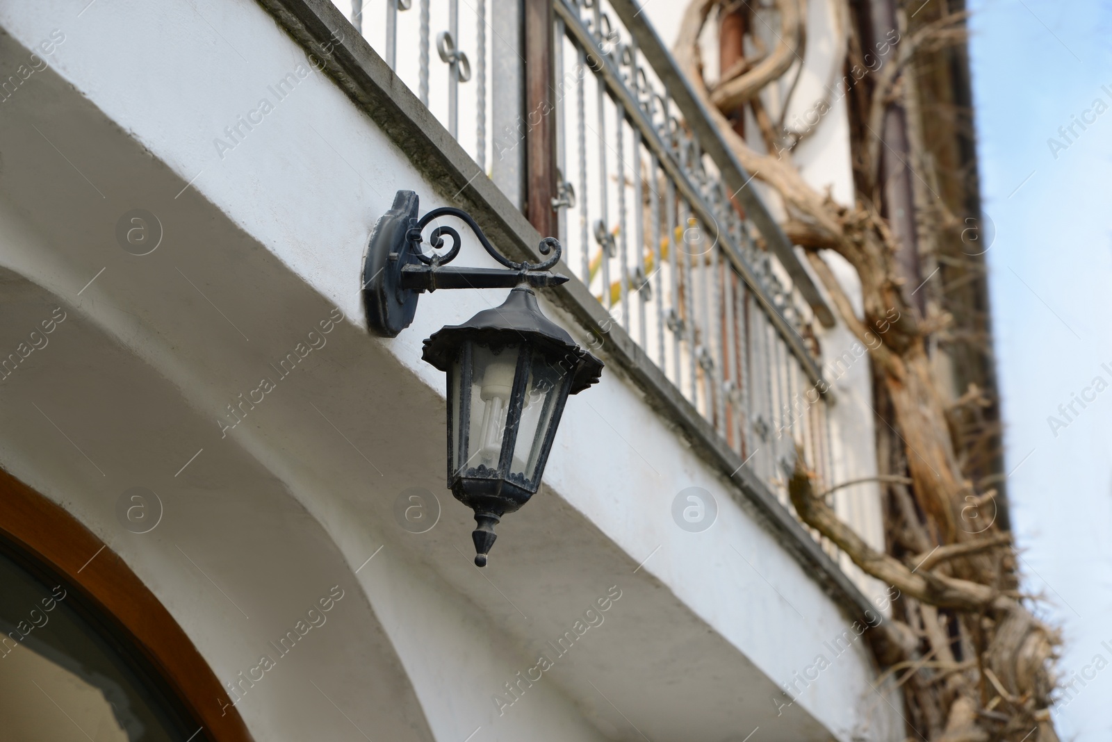 Photo of Vintage street lamp on wall of building