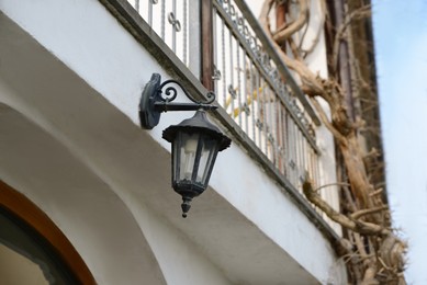 Vintage street lamp on wall of building