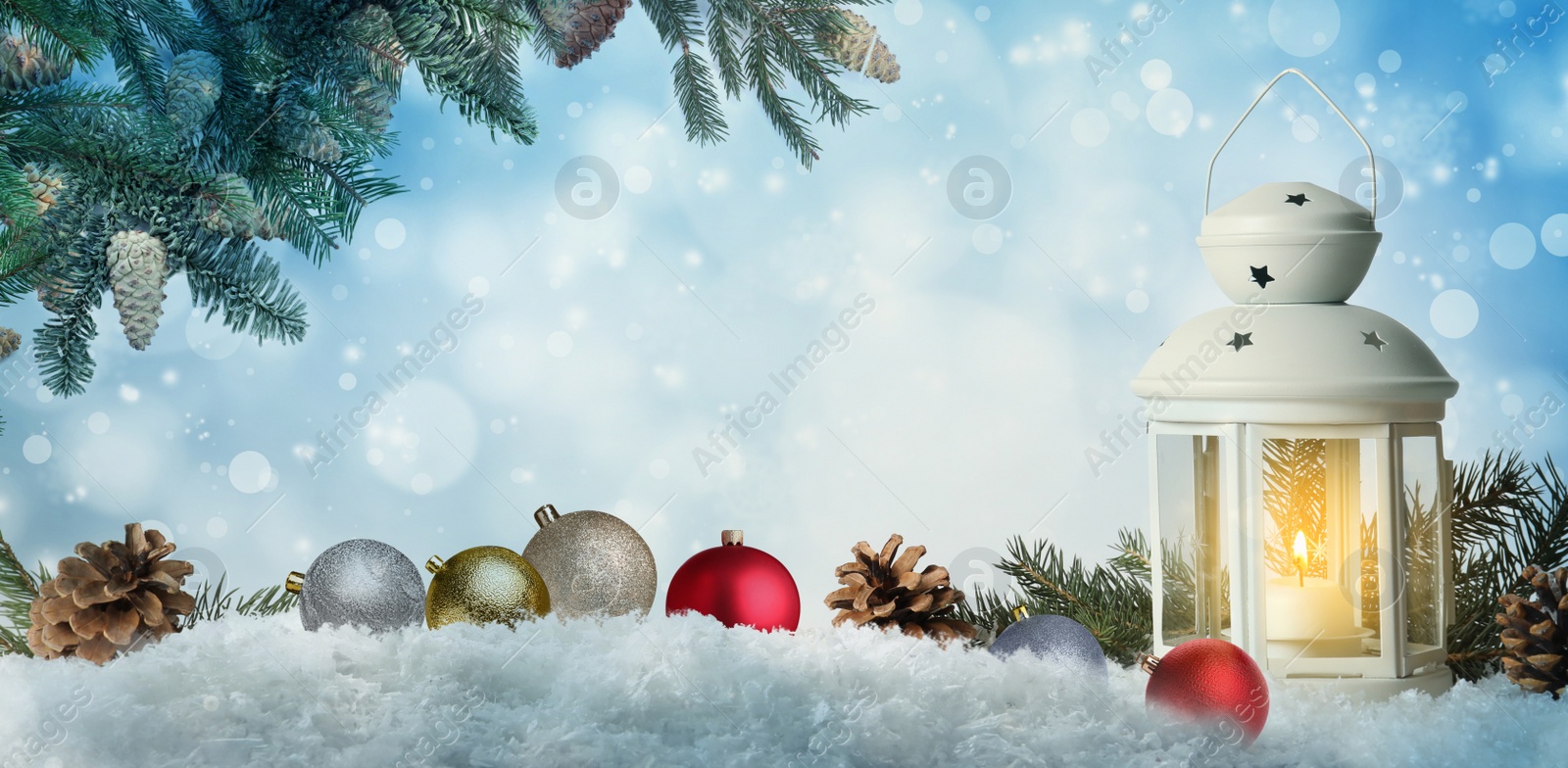 Image of Beautiful composition with vintage Christmas lantern and festive decorations on snow against color background, banner design. Bokeh effect