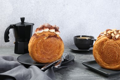 Crunchy round croissants served on grey table. Tasty puff pastry