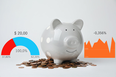 Image of White piggy bank with coins and graphs on light background