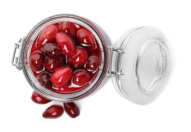 Photo of Delicious dogwood jam with berries on white background, top view