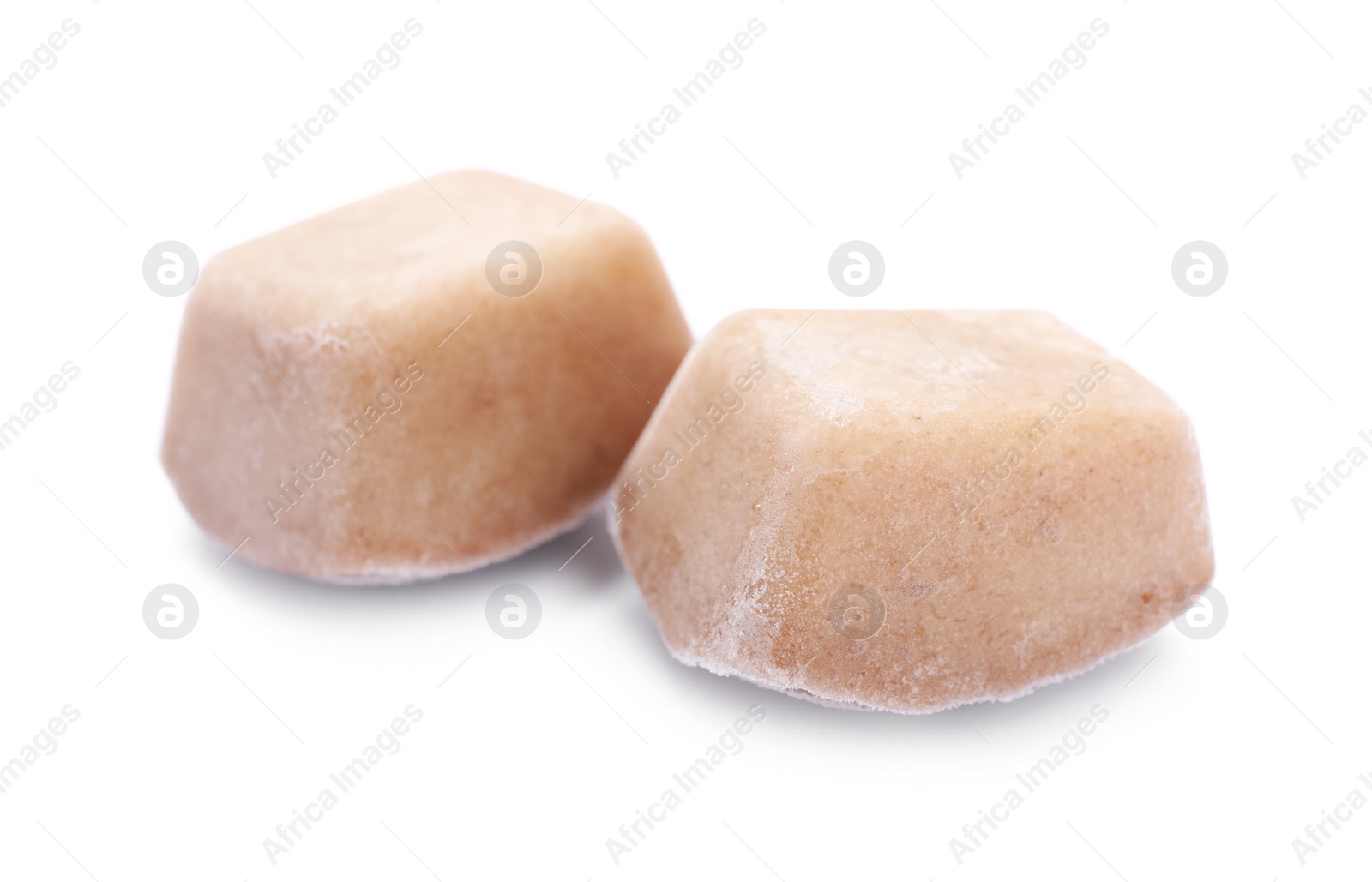 Photo of Frozen fruit puree cubes on white background