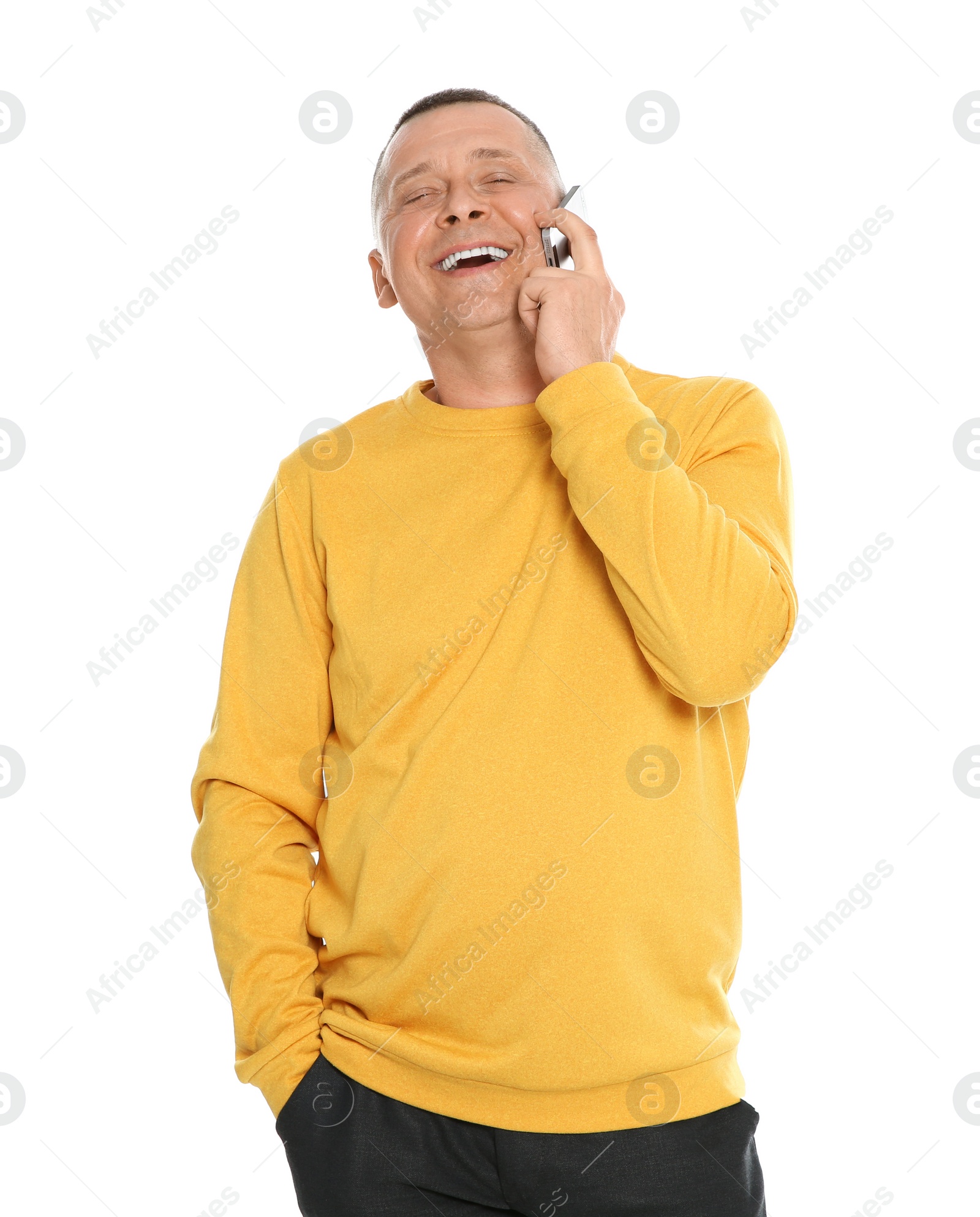 Photo of Portrait of emotional mature man talking on mobile phone against white background