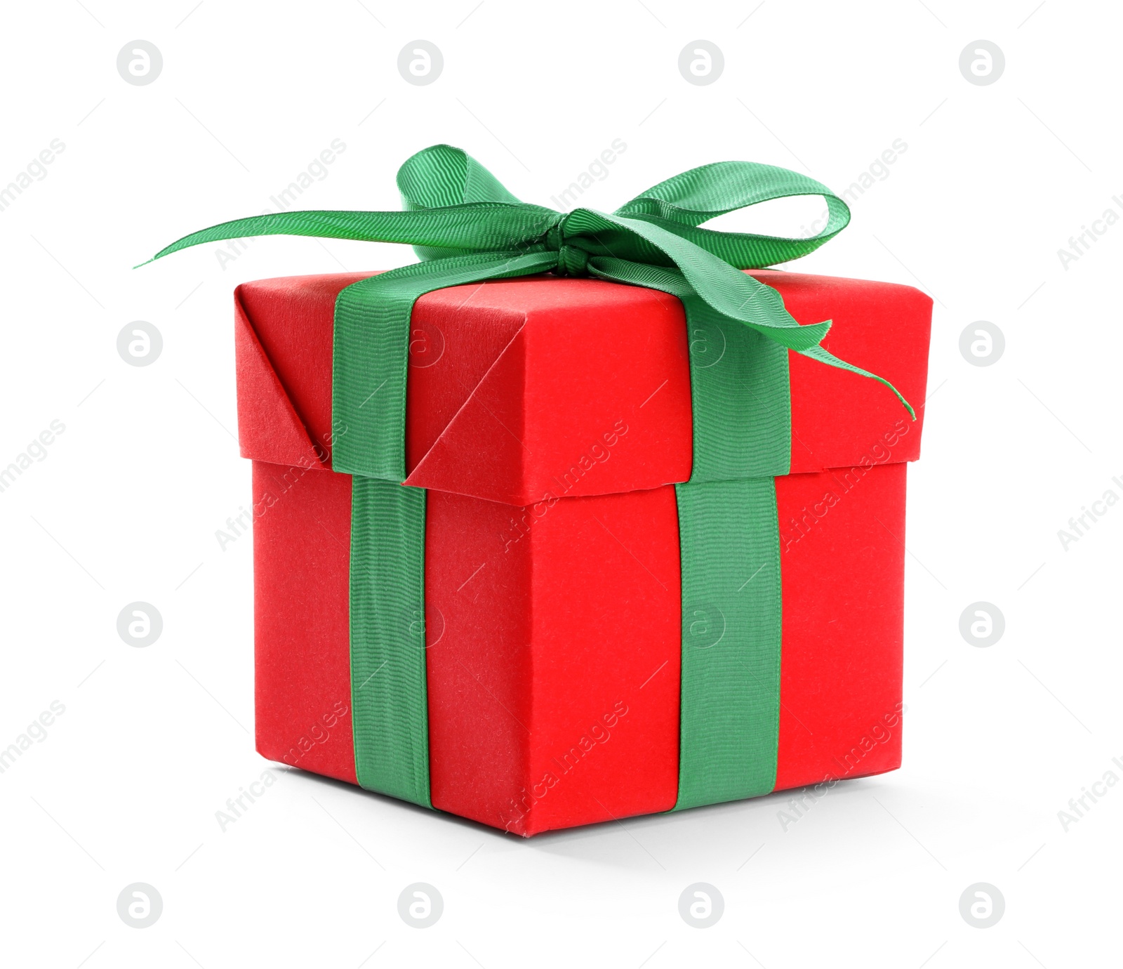 Photo of Christmas gift box decorated with green bow isolated on white