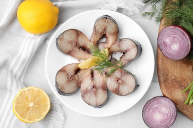 Photo of Slices of tasty salted mackerel and ingredients on white table, flat lay