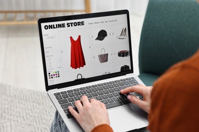 Photo of Woman with laptop shopping online at home, closeup