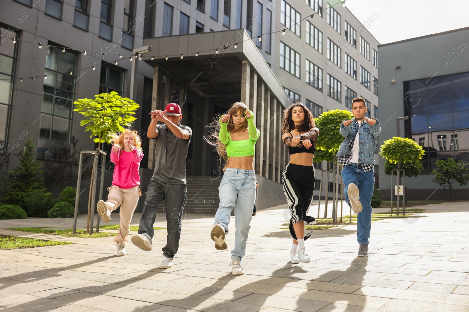 Photo of Group of people dancing hip hop outdoors