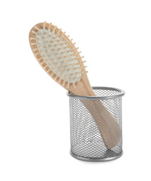 Photo of New wooden hair brush in metal holder isolated on white