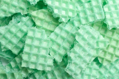 Tasty crushed wafers as background, closeup. Crispy food