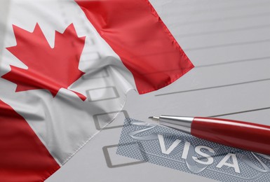 Image of Visa to Canada. Multiple exposure with national flag and pen, closeup