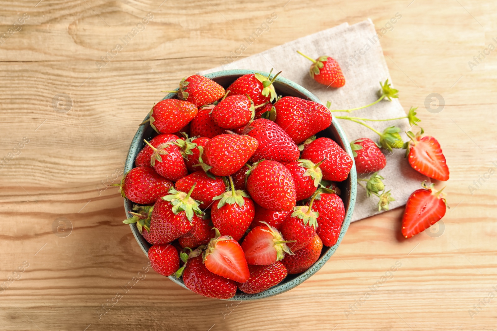 Photo of Flat lay composition with fresh strawberries on wooden background