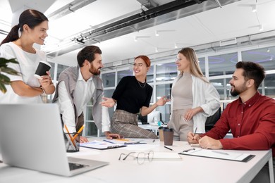 Team of employees working together in office