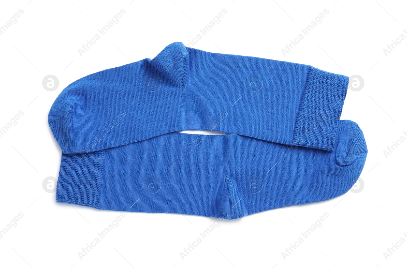 Photo of Pair of blue socks on white background, top view
