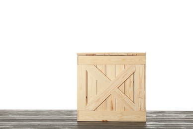 Photo of Wooden crate on table against white background. Space for text