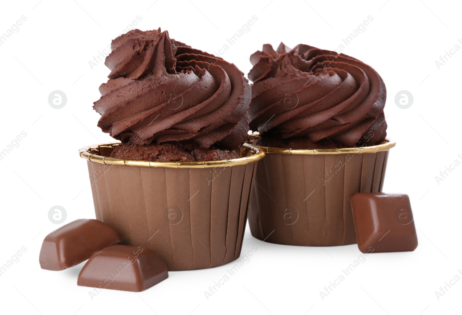 Photo of Delicious cupcakes and chocolate pieces isolated on white