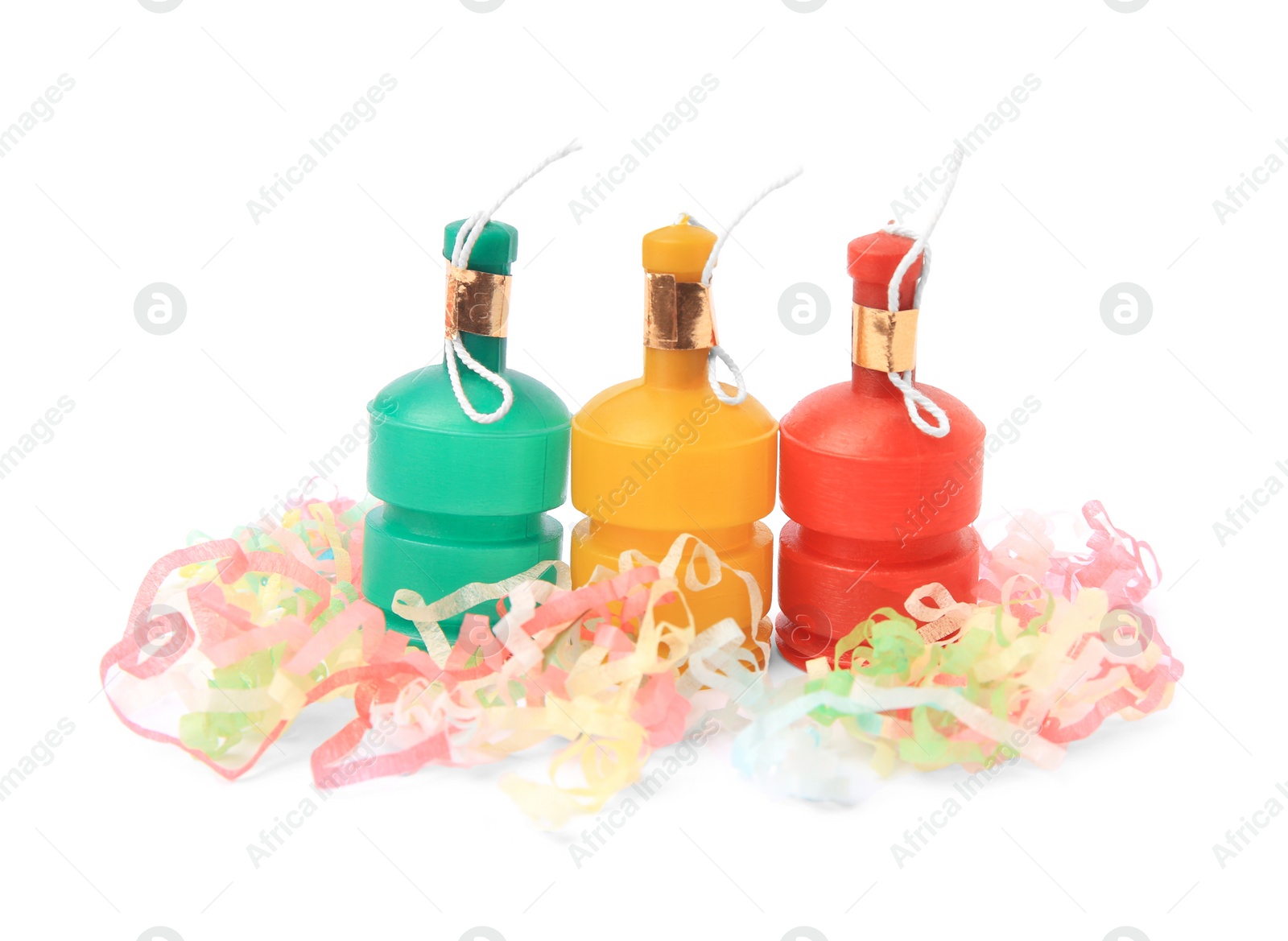 Photo of Colorful streamers with bright party crackers isolated on white