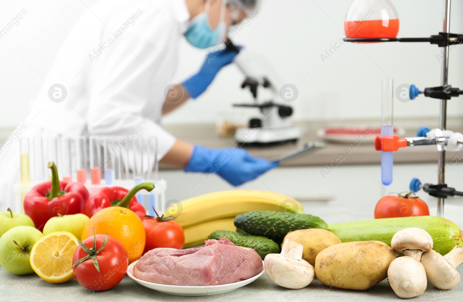 Photo of Different products on table and scientist in laboratory. Quality control