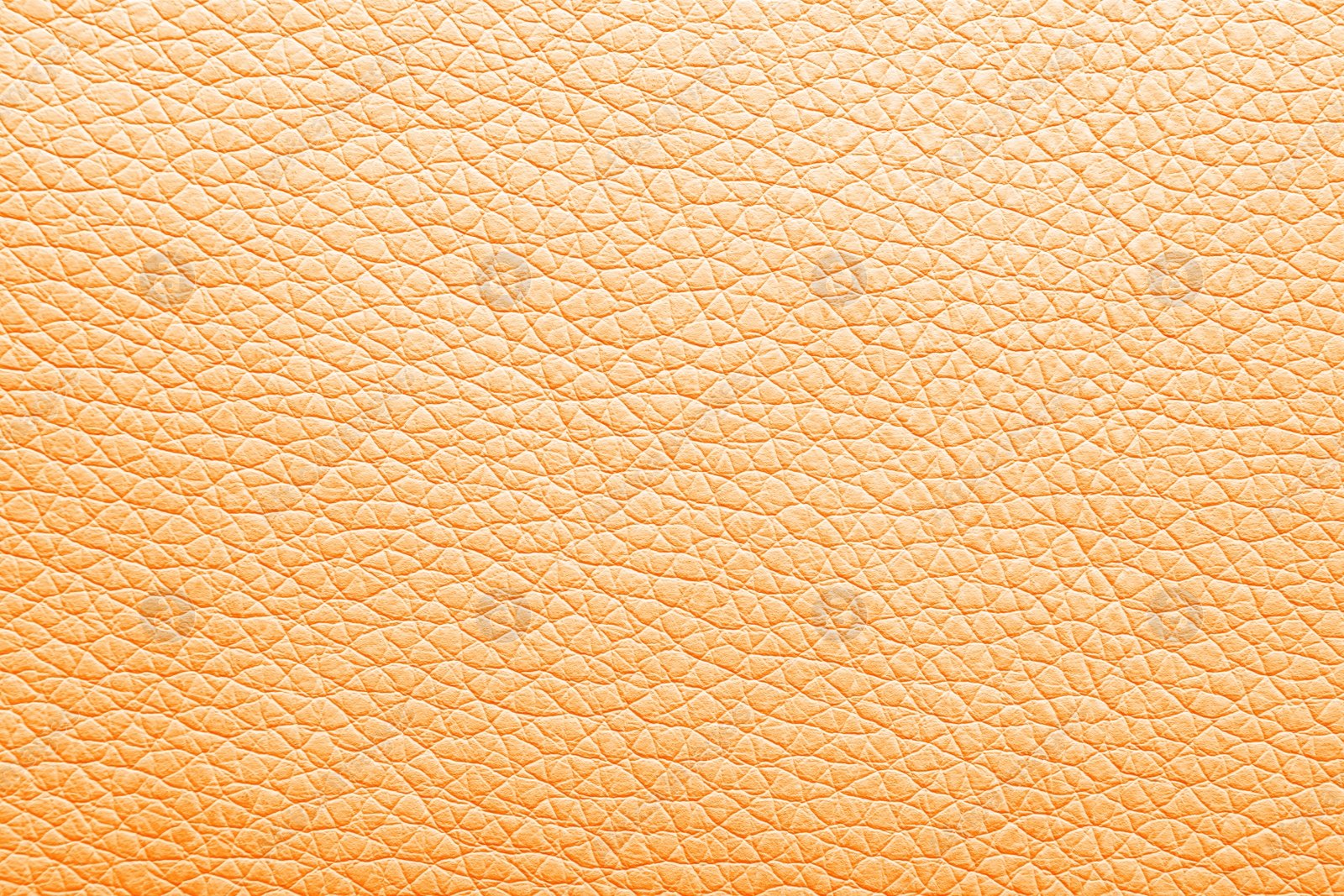 Image of Texture of orange leather as background, closeup