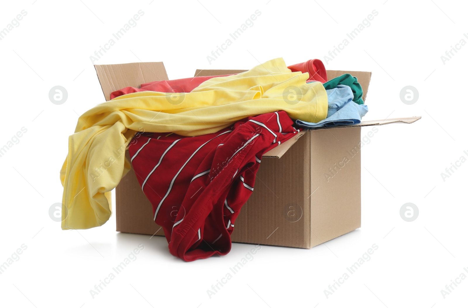 Photo of Cardboard box with clothes isolated on white