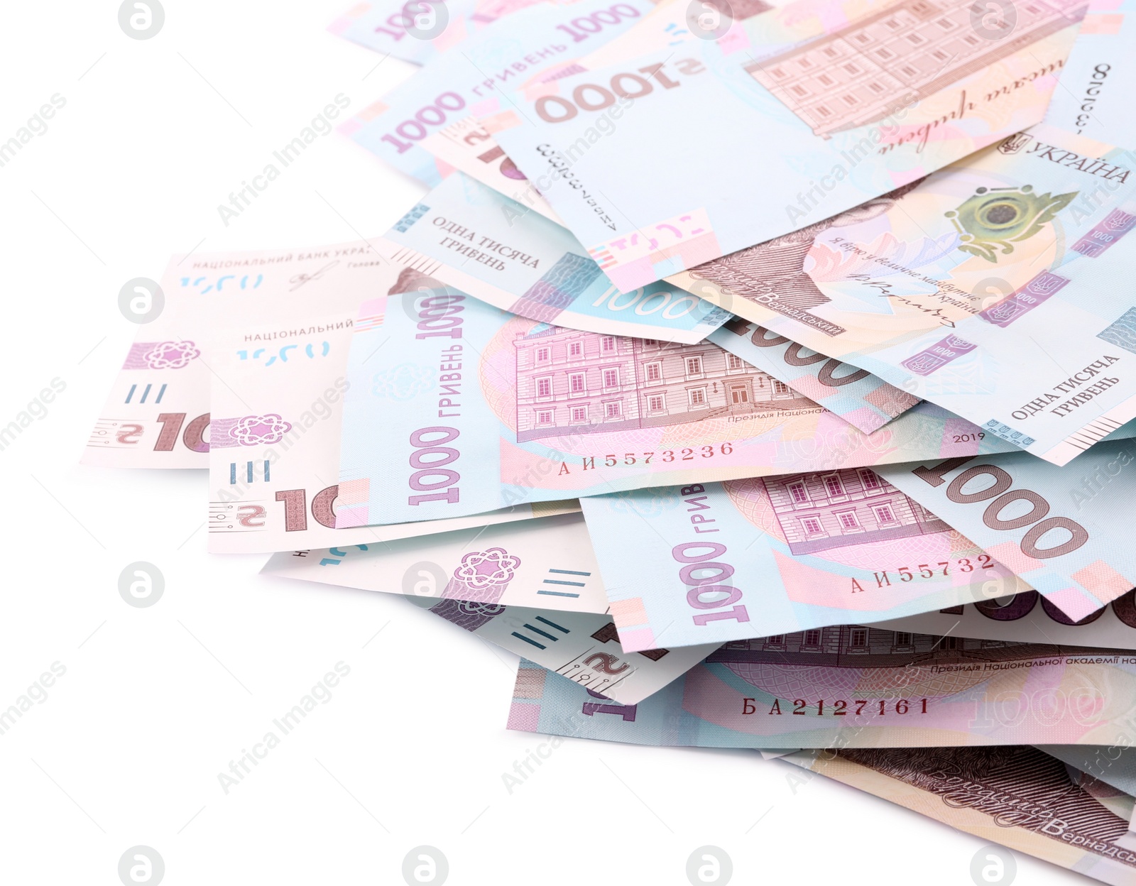 Photo of 1000 Ukrainian Hryvnia banknotes on white background, closeup