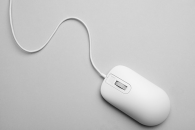 Photo of Wired computer mouse on light grey background, top view