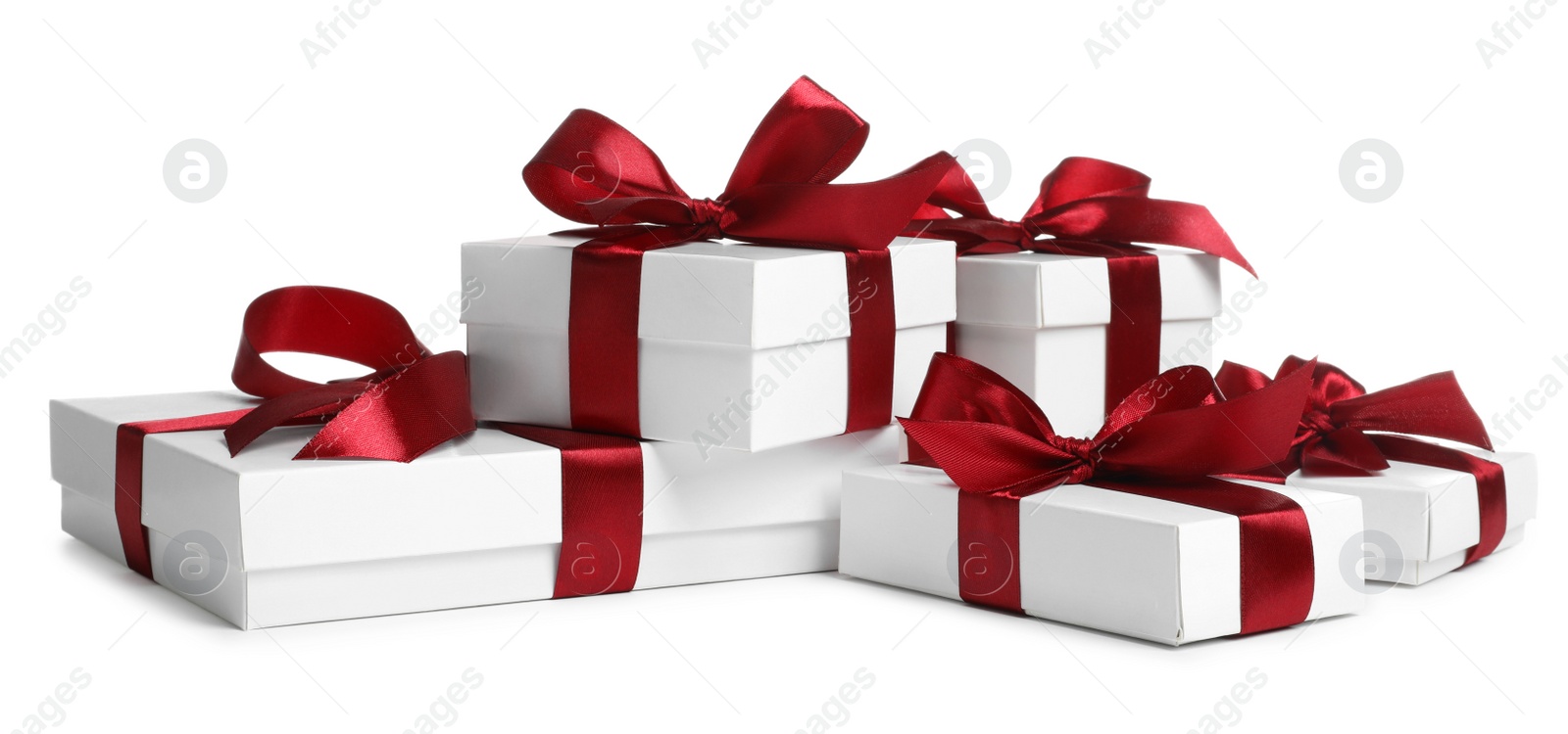 Photo of Many boxes with Christmas gifts on white background