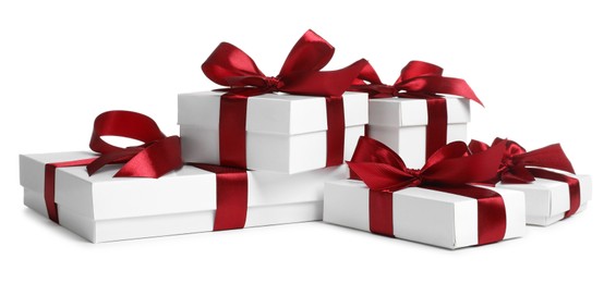 Photo of Many boxes with Christmas gifts on white background